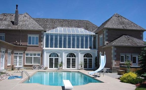 Two-Storey White Conservatory Overlooking Pool