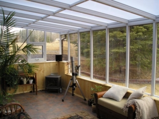 Alternate interior view of a white straight eave sunroom