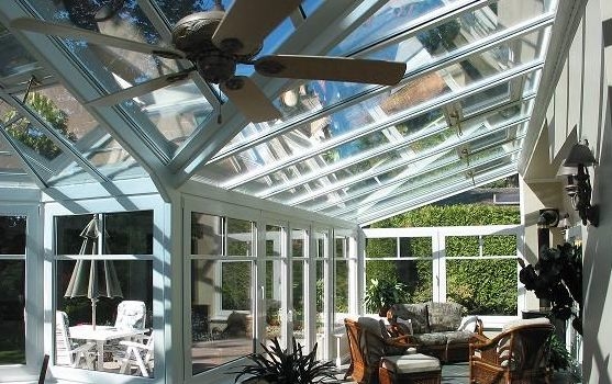 A different interior view of a large white Victorian-style conservatory