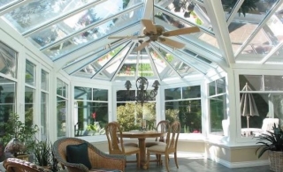 Interior view of a large white Victorian-style conservatory