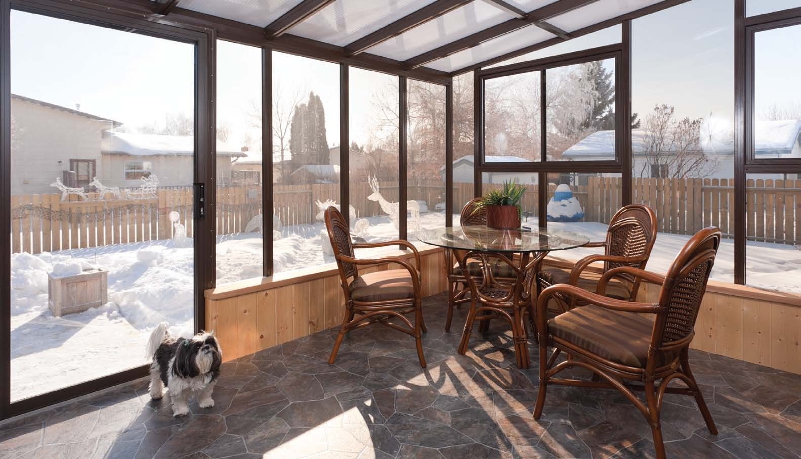 An interior view of a sunroom in winter